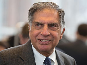 Ratan Tata in a formal grey suit and patterned tie at a professional event HD wallpaper