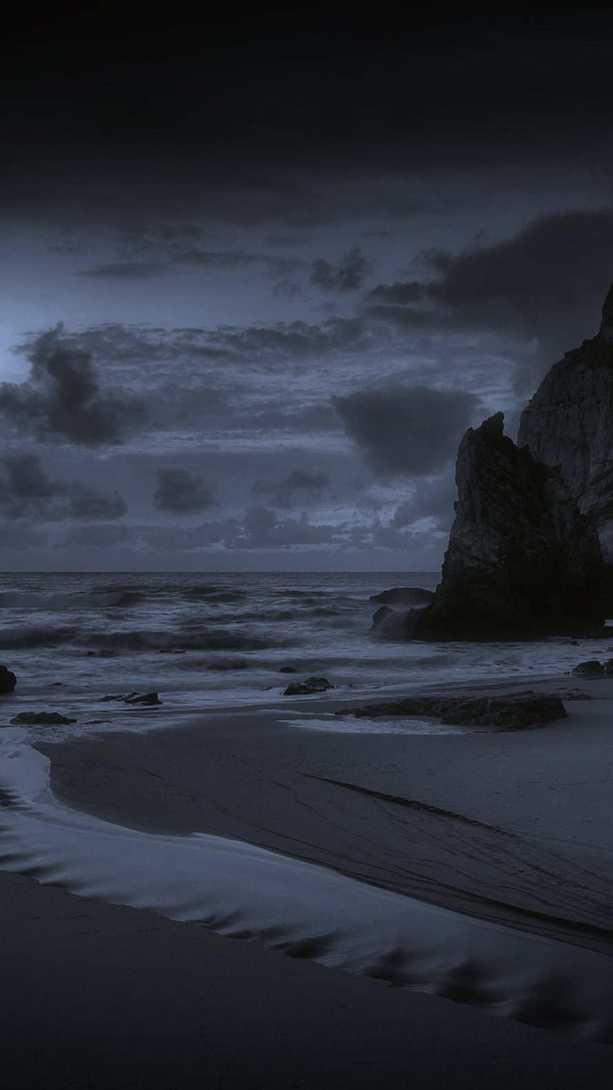 Moody Dark Beach with Rocky Cliffs and Stormy Ocean Waves HD phone wallpaper