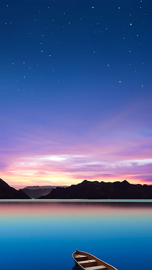 Serene Mountain Lake at Twilight with Starry Sky and Wooden Boat HD phone wallpaper
