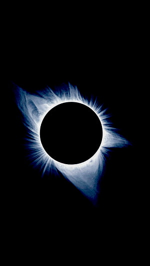 Stunning Total Solar Eclipse with Blue Corona and Black Sky Background HD phone wallpaper