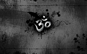 Grunge Om Symbol with Ink Splatter and Floral Swirls on Dark Textured Background HD wallpaper
