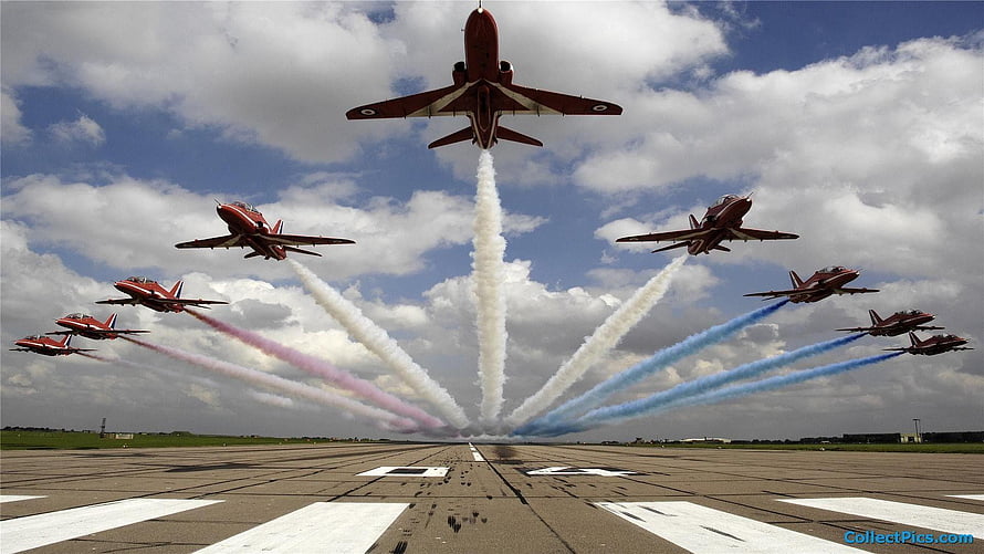 Indian Air Force jets performing a synchronized smoke trail display over an airfield runway HD wallpaper