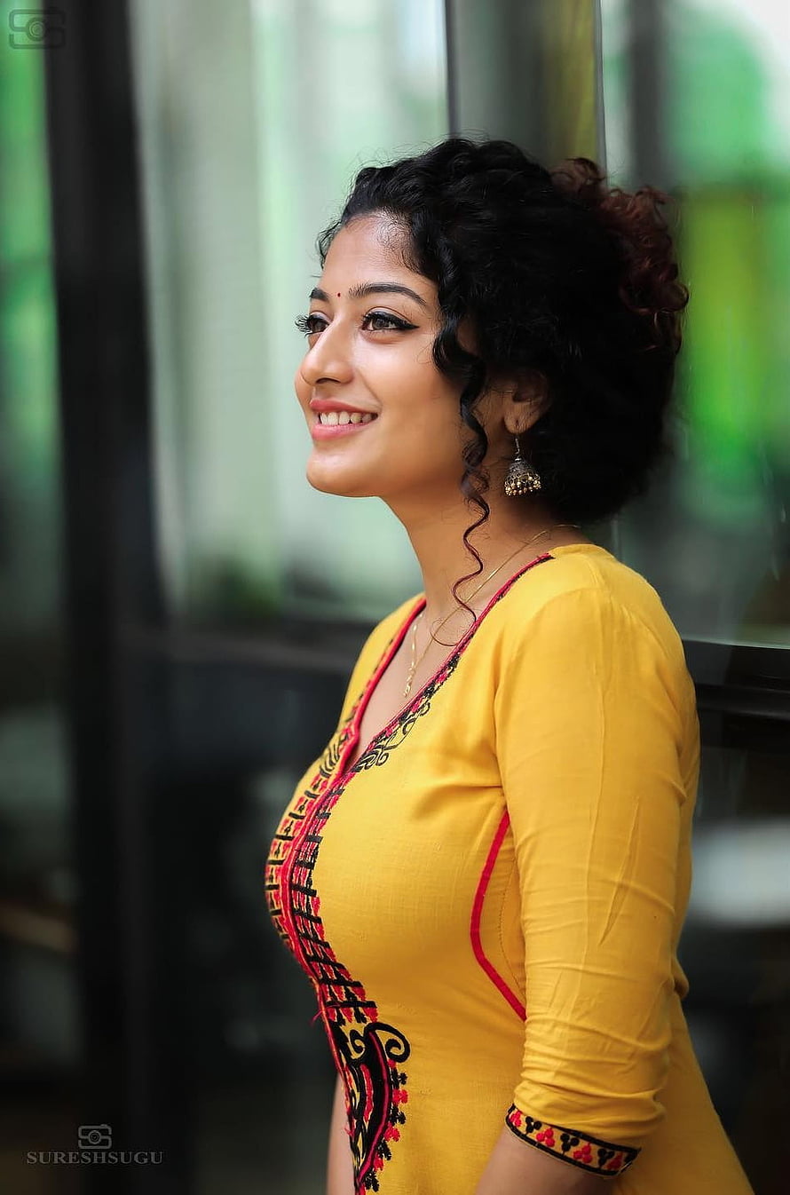 Portrait of a smiling woman wearing a yellow embroidered kurta with red accents and traditional jewelry, Anjali nair, lip, thigh HD phone wallpaper