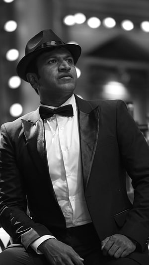 Puneeth Rajkumar in Classic Tuxedo and Fedora Hat Black and White Portrait HD phone wallpaper