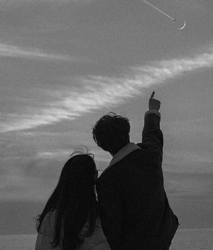 Silhouette of a couple pointing at the crescent moon and airplane trail in the sky HD phone wallpaper
