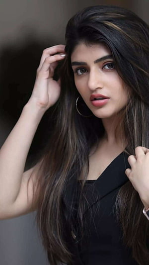 Portrait of Indian Actress Pooja Hegde with Long Hair and Black Dress HD phone wallpaper