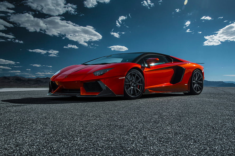 Red Lamborghini Aventador LP 740-4 Super Car on Desert Asphalt Under Blue Sky HD wallpaper