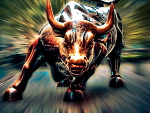 Dynamic Bronze Bull Statue Charging Forward With Dramatic Motion Blur Background HD wallpaper