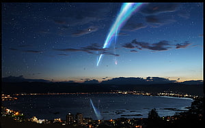 Stunning Night Sky Photography Featuring a Bright Meteor Streaking Over a Coastal Cityscape HD wallpaper