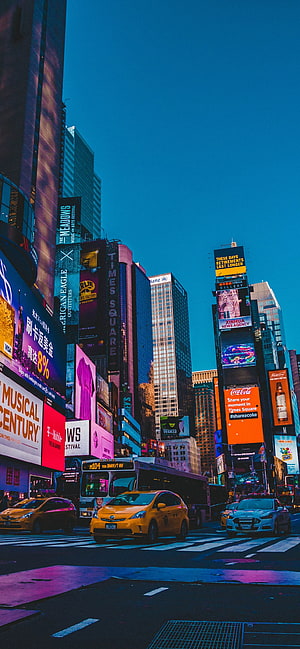 Vibrant Times Square New York City Street Scene with Yellow Taxis and Neon Billboards HD phone wallpaper