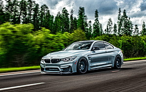 Silver BMW M4 F82 Coupe Driving on a Forest Road with Motion Blur HD wallpaper