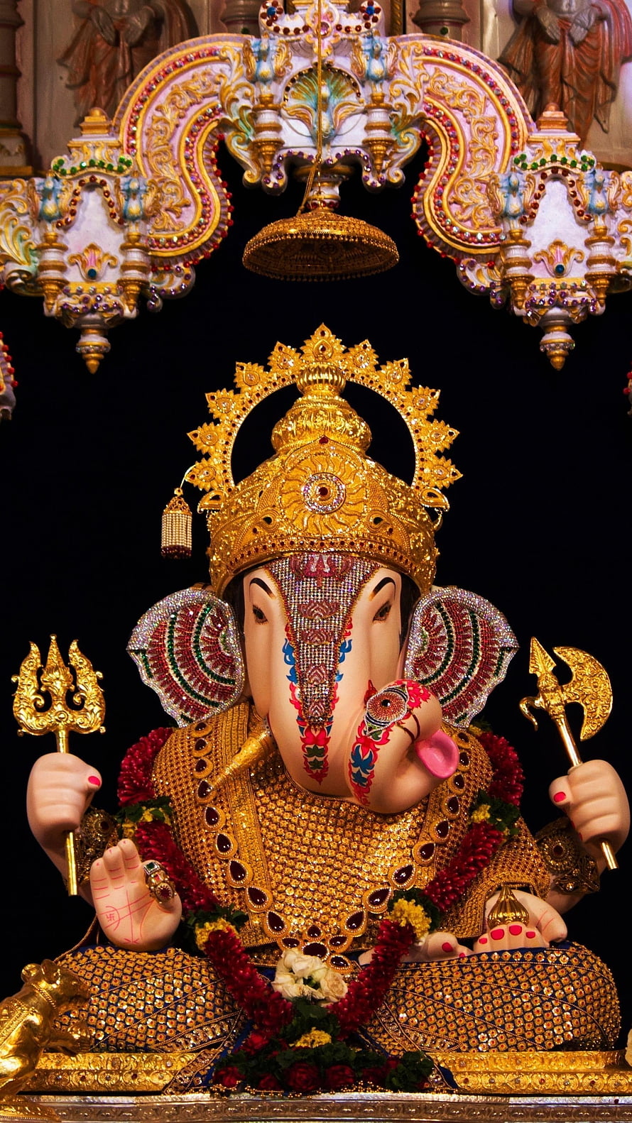 Ornate Golden Ganesha Idol with Jeweled Crown and Trishul HD phone wallpaper