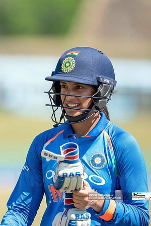 Smriti Mandhana in Indian Cricket Team Blue Jersey and Helmet HD phone wallpaper