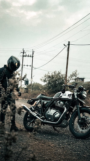 Royal Enfield Classic Motorcycle Parked on Gravel Road with Rider HD phone wallpaper
