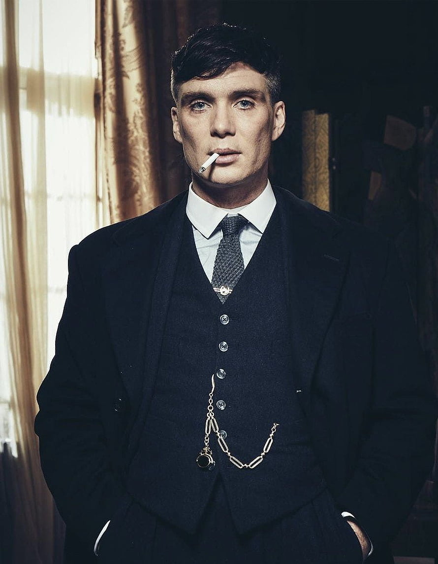 Cillian Murphy as Thomas Shelby in a formal three-piece suit with a cigarette and pocket watch chain HD phone wallpaper