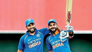 Rohit Sharma and Virat Kohli Celebrating in India Cricket Team Blue Jerseys HD wallpaper