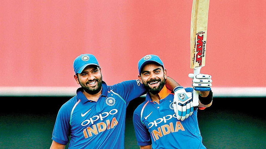 Rohit Sharma and Virat Kohli Celebrating in India Cricket Team Blue Jerseys HD wallpaper