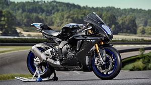Yamaha YZF-R1M Superbike on Track with Carbon Fiber Bodywork and Blue Accents HD wallpaper