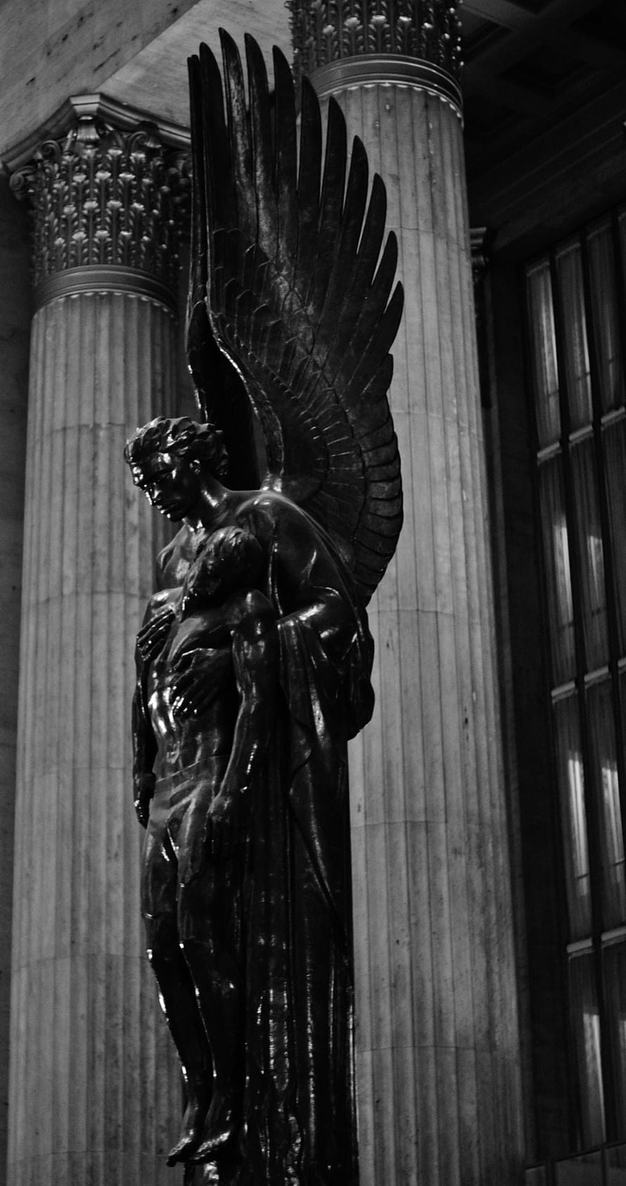 Black and White Photograph of Winged Angel Sculpture in Classical Architecture HD phone wallpaper