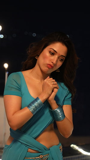 Bollywood actress Tamannaah Bhatia posing in a stylish teal saree with traditional jewelry at night, F2 movie, tamanna bhatia, saree beauty HD phone wallpaper