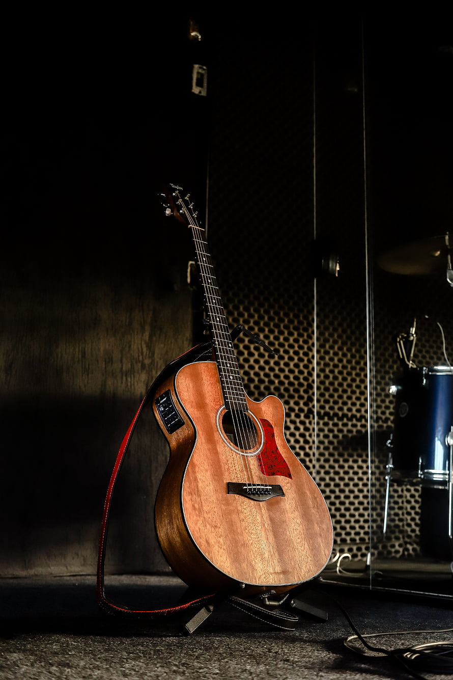 Acoustic Guitar on Stand in Dimly Lit Recording Studio with Drum Kit HD phone wallpaper