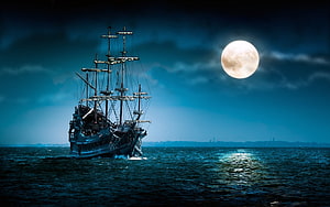 Pirates of the Caribbean Galleon Sailing Under a Full Moon on a Dark Ocean HD wallpaper
