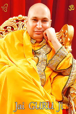 Portrait of a spiritual guru in yellow robes sitting on a golden throne HD phone wallpaper