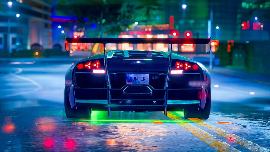 Rear View of a Black Supercar with Neon Underglow on a Wet City Street at Night HD wallpaper