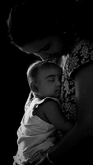 Black and White Portrait of a Mother Holding a Sleeping Baby Close HD phone wallpaper