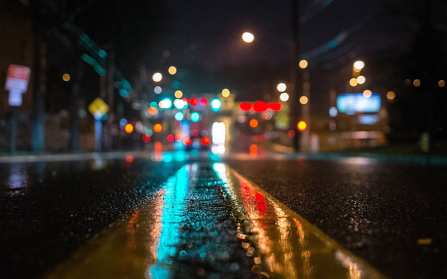 Rainy City Street at Night with Bokeh Traffic Lights and Wet Asphalt Reflections HD wallpaper