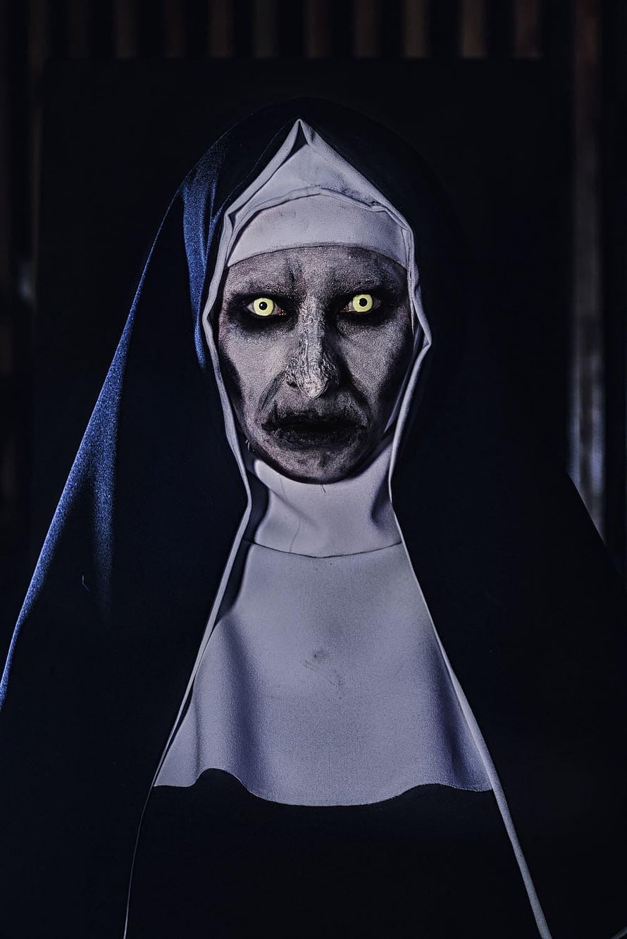 Valak The Nun Horror Character Portrait with Glowing Yellow Eyes and Dark Habit HD phone wallpaper