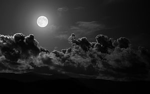 Dramatic Black And White Full Moon Rising Over Dark Clouds And Mountain Silhouette HD wallpaper