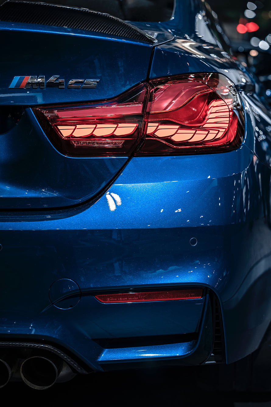 Close-Up of Blue BMW M4 CS Rear Taillight and Exhaust HD phone wallpaper