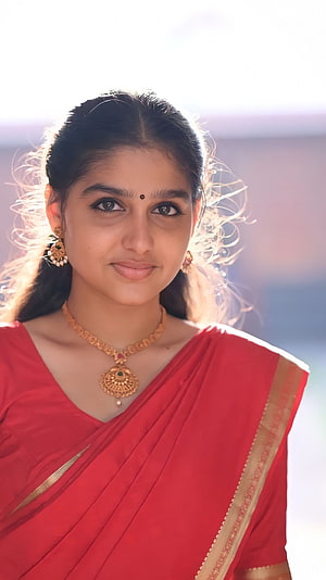 Anaswara in a red sari with gold jewelry and bindi HD phone wallpaper
