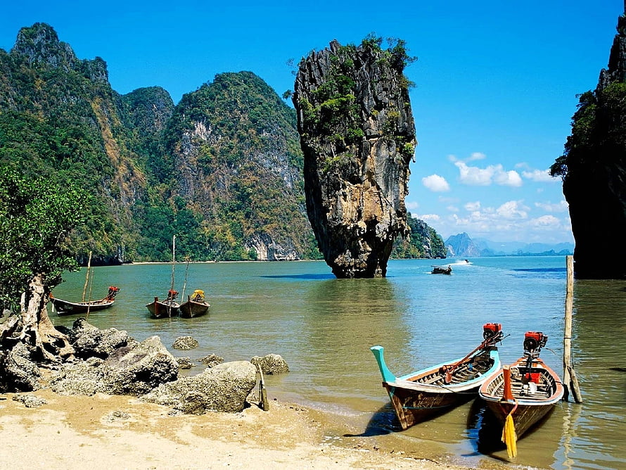 Tropical Thai Bay With Longtail Boats And Dramatic Limestone Sea Stalagmite HD wallpaper