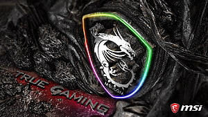 MSI Gaming Logo with RGB Lighting on Dark Textured Background HD wallpaper