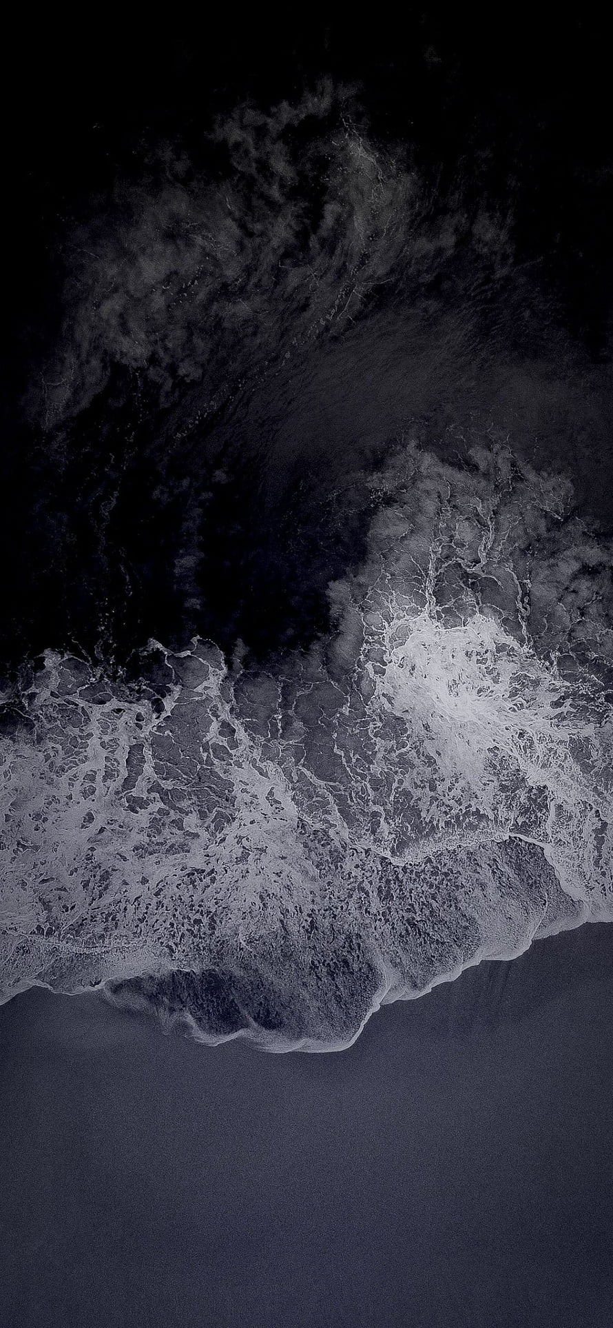 Aerial View of Dark Ocean Waves Crashing on Shore in Monochrome HD phone wallpaper