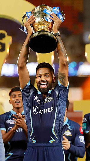 Kieron Pollard lifting the trophy in Delhi Capitals jersey celebrating victory HD phone wallpaper