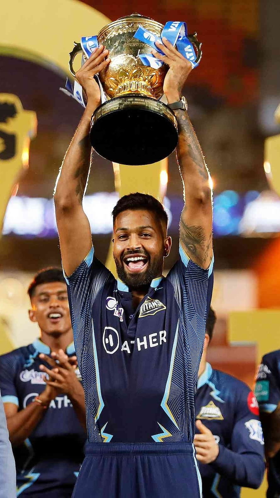 Kieron Pollard lifting the trophy in Delhi Capitals jersey celebrating victory HD phone wallpaper