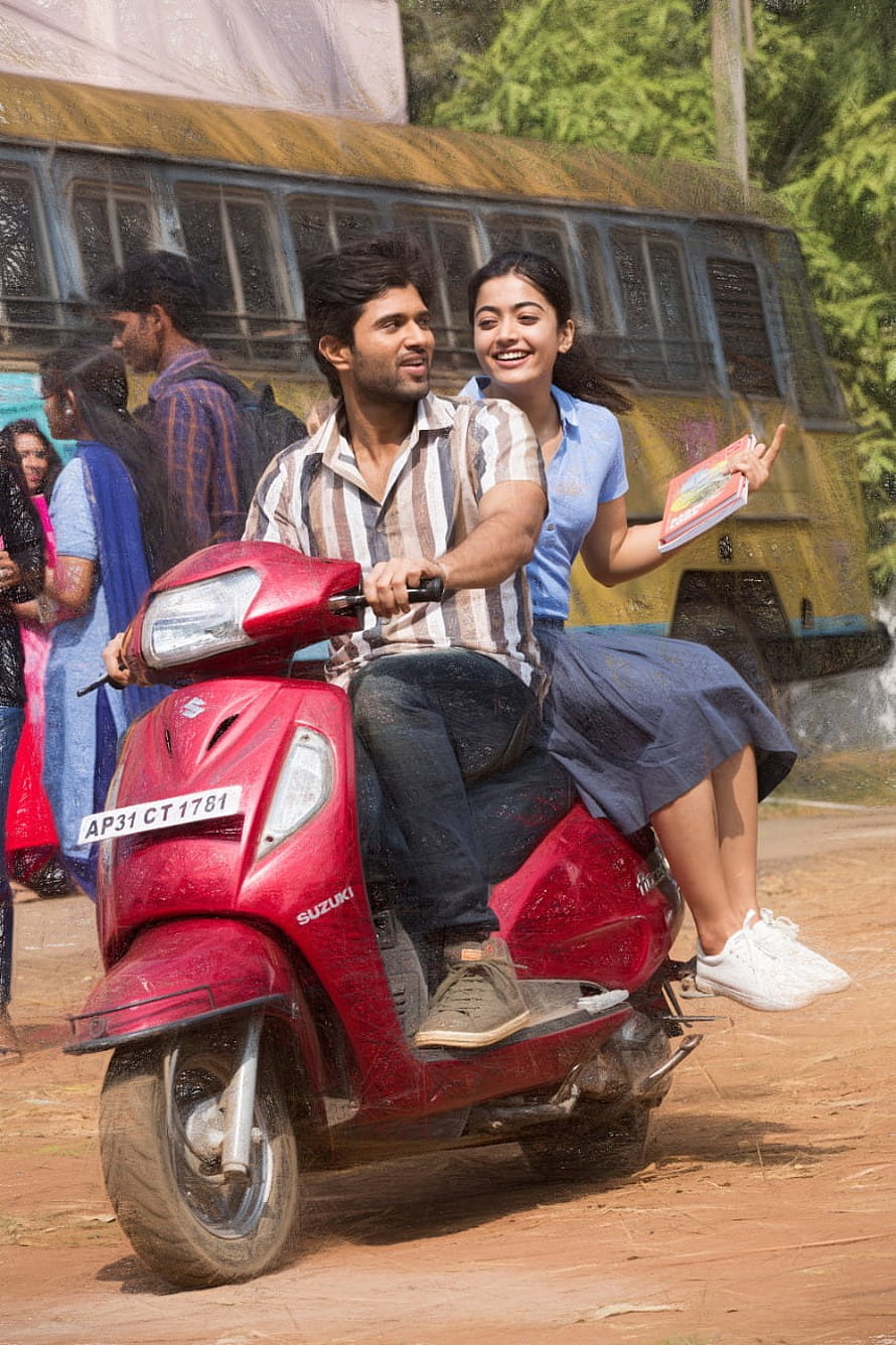 Vijay Deverakonda and Rashmika Mandana Riding a Red Suzuki Scooter in a Cinematic Scene HD phone wallpaper