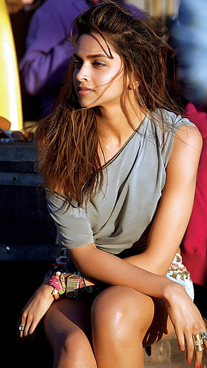 Deepika Padukone in a Casual Grey Top with Windblown Hair and Statement Jewelry HD phone wallpaper