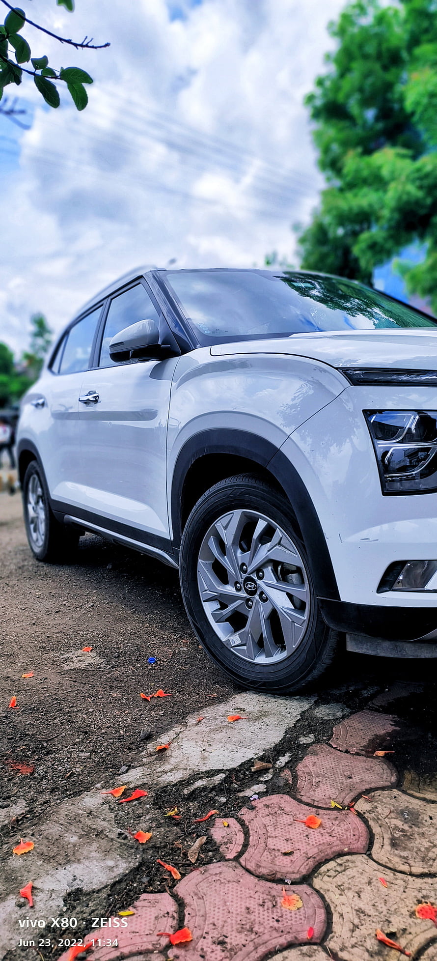 White Hyundai Creta SUV Parked on Gravel Road Under Cloudy Sky HD phone wallpaper