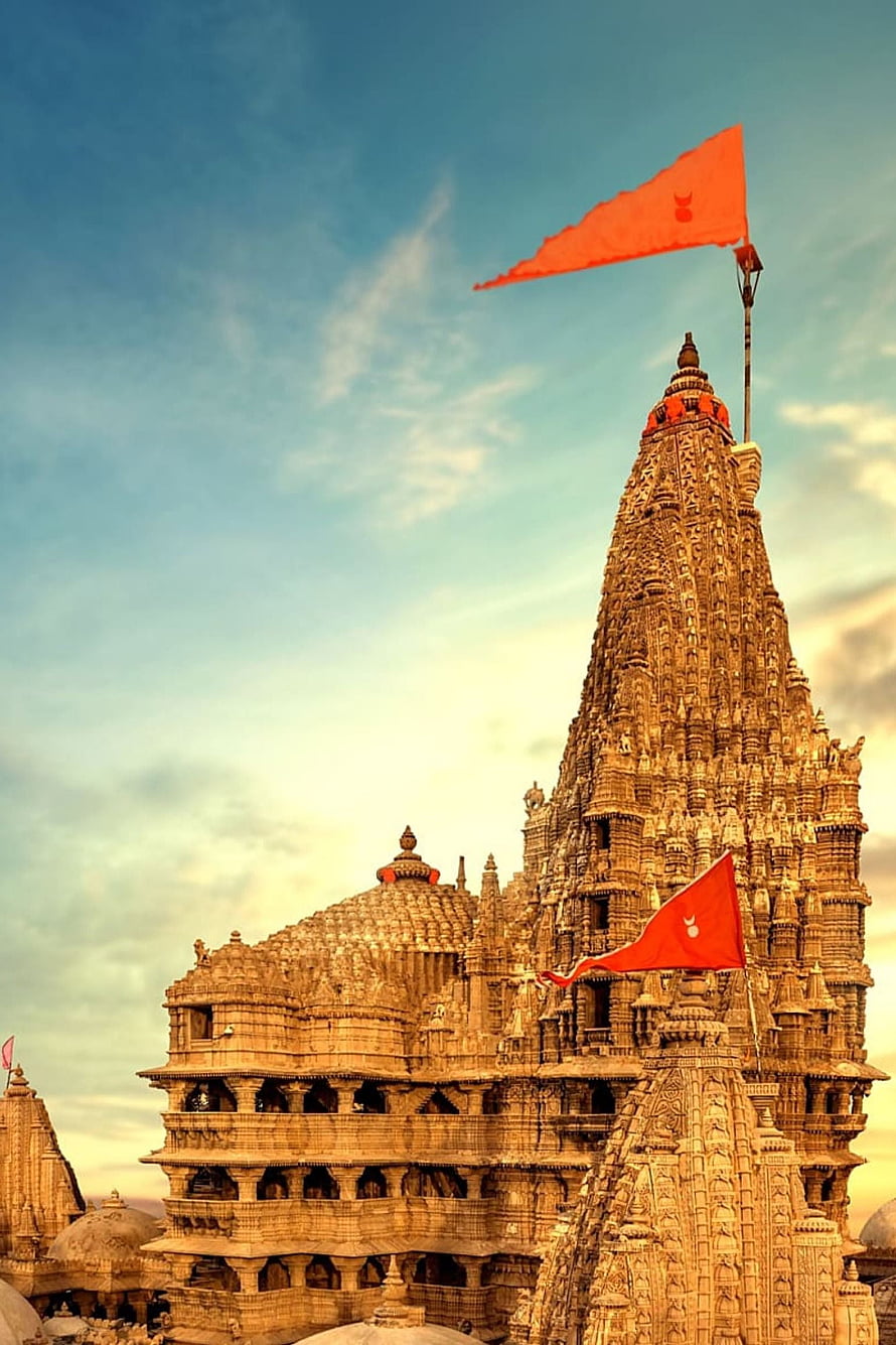 Magnificent Khajuraho Temple Architecture with Intricate Stone Carvings and Orange Flags HD phone wallpaper