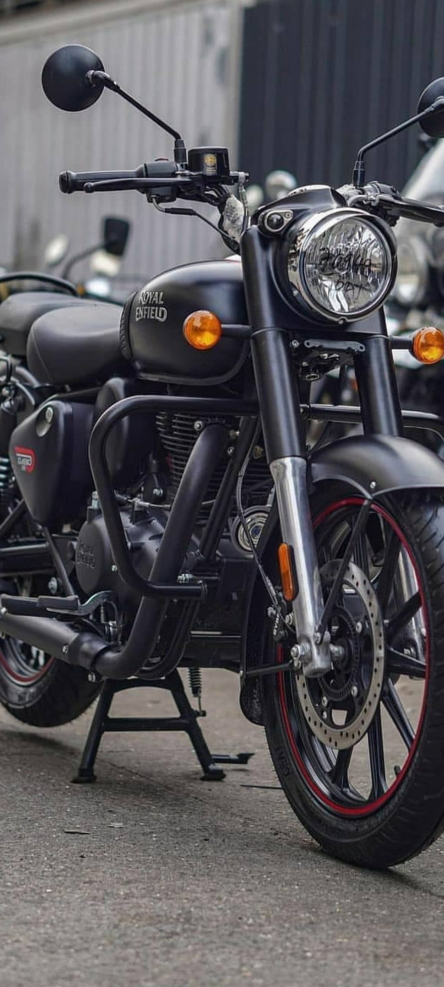 Matte Black Royal Enfield Classic 350 Motorcycle with Red Rim Accents HD phone wallpaper