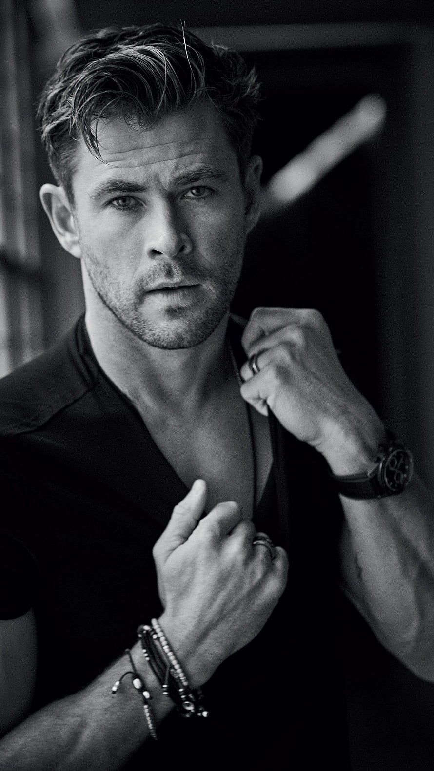 Chris Hemsworth Black and White Portrait with Intense Gaze and Studded Bracelets HD phone wallpaper