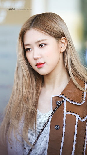 Rose from Blackpink in a brown leather jacket with long blonde hair HD phone wallpaper