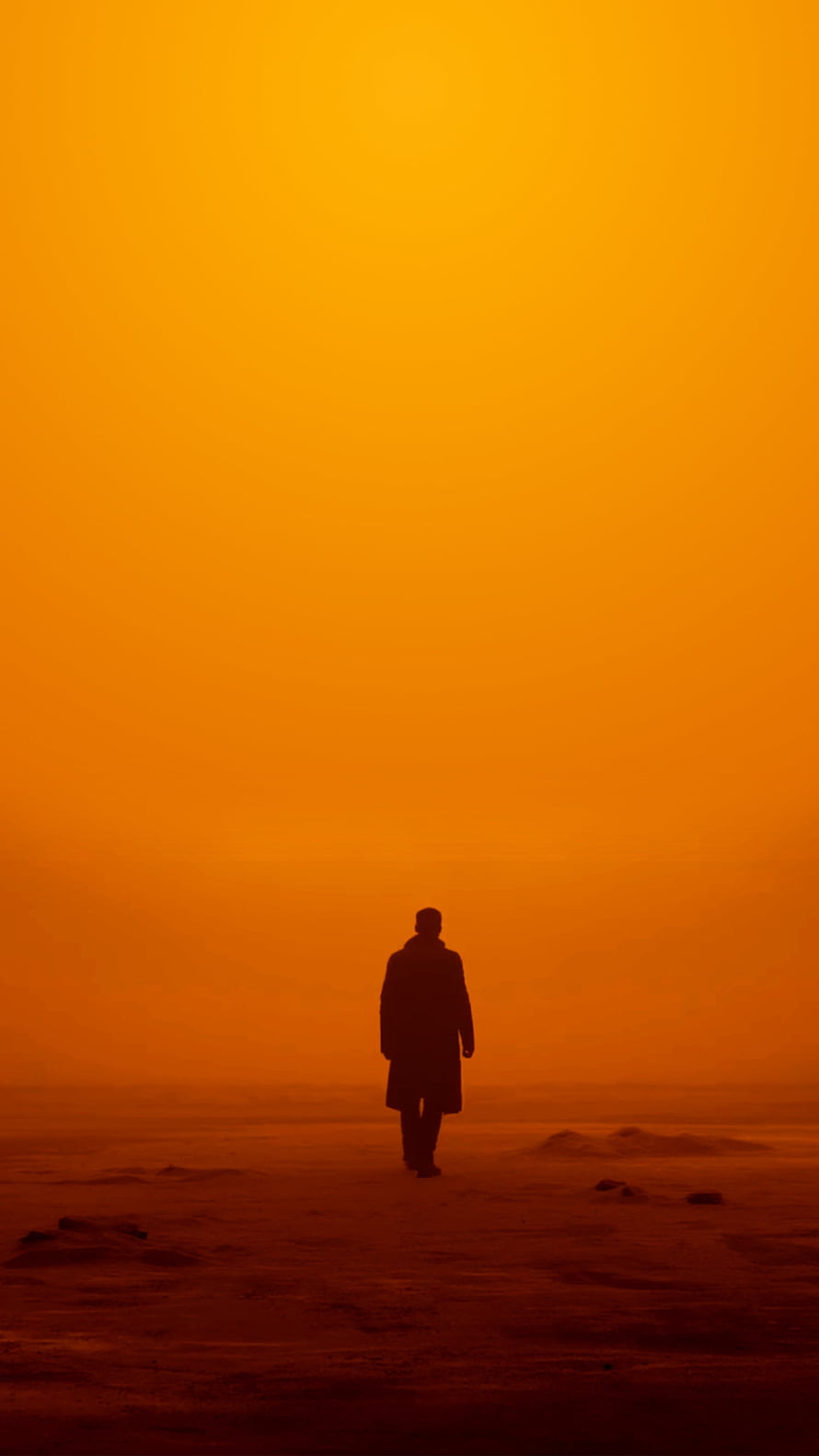 Silhouette of a Lone Walker in a Vibrant Orange Haze HD phone wallpaper