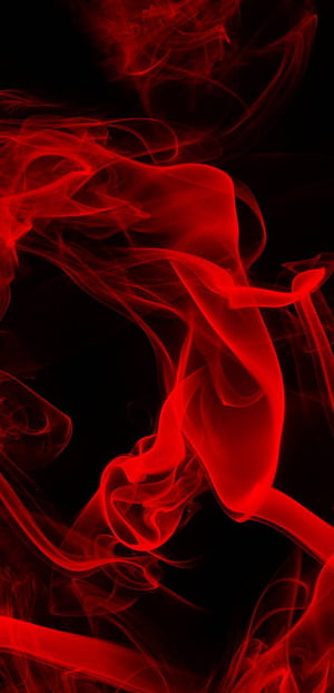 Vibrant red smoke swirling against a deep black background in an abstract, high-contrast composition HD phone wallpaper