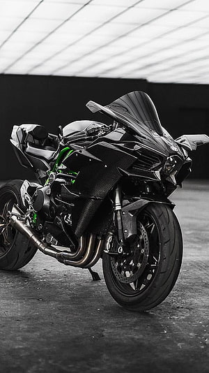 Black Kawasaki Ninja Sport Motorcycle with Carbon Fiber Bodywork and Green Frame Accents HD phone wallpaper