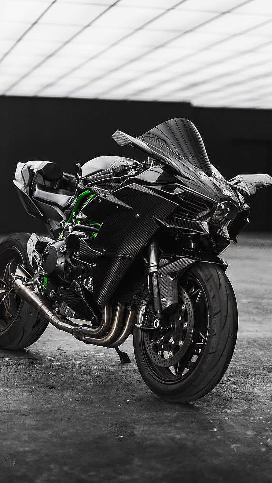 Black Kawasaki Ninja Sport Motorcycle with Carbon Fiber Bodywork and Green Frame Accents HD phone wallpaper